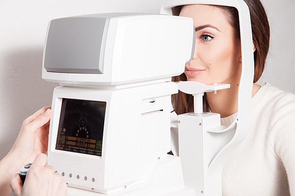 Patient Looking Into Optical Equipment